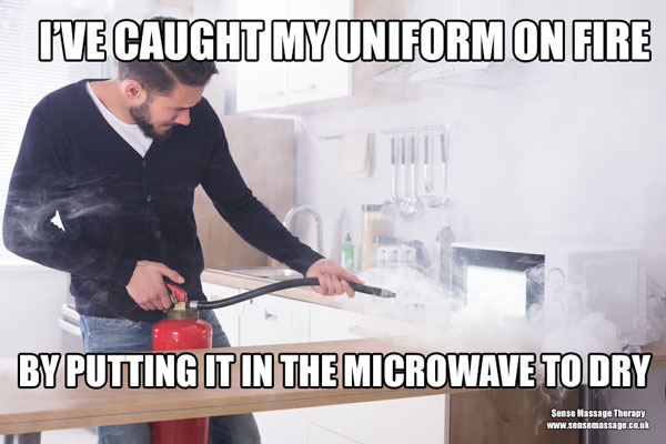 Man putting out a microwave fire
