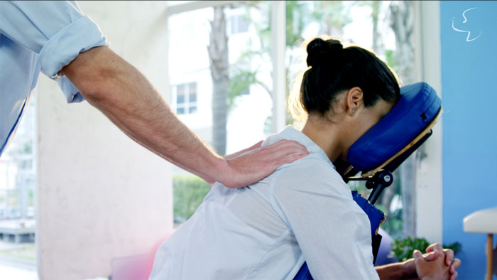 chair massage being given in an office