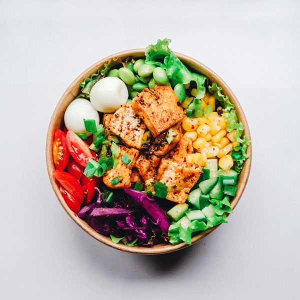 bowl of grilled cheese and salad