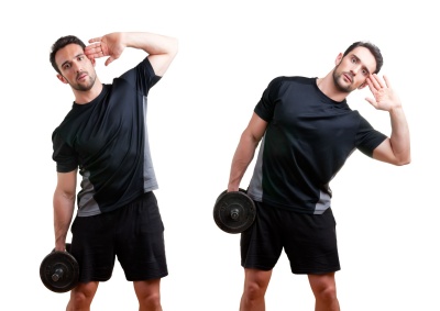 Man doing side bends with a weight