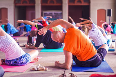 Group of people sat doing yoga
