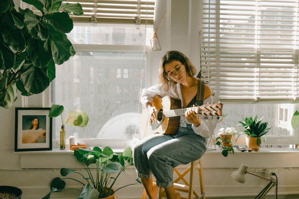 woman playing guitar