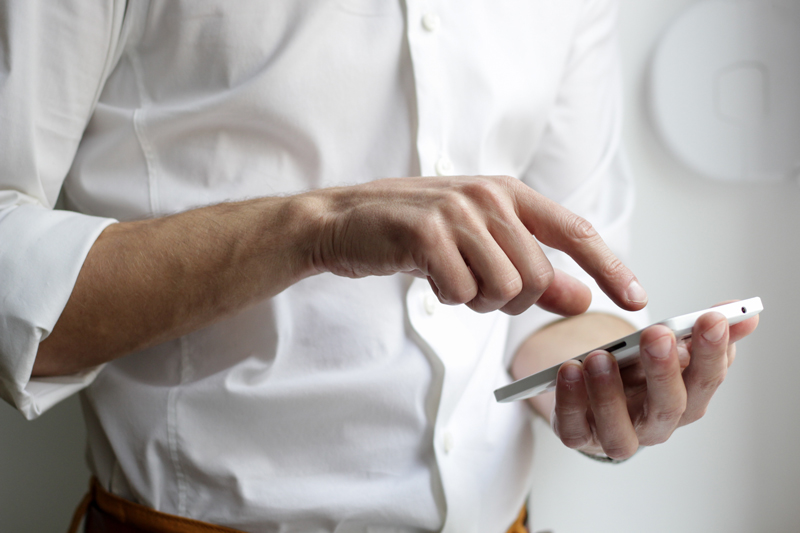 man downloading a mindfulness app
