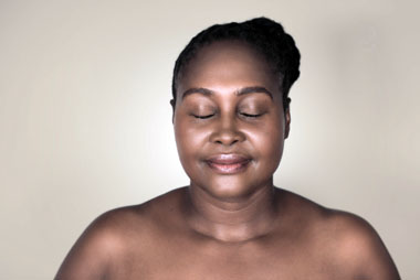 Woman smiling with eyes closed